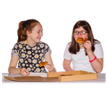 Two people eating at a table