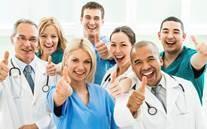 A group of medical staff giving a thumbs-up