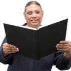 A woman reading from a large folder