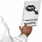 Man holding a piece of paper saying "I want to say something"