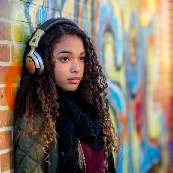 Young person earing headphones