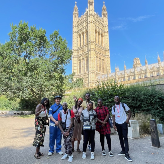 youth council members standing outside of parliament