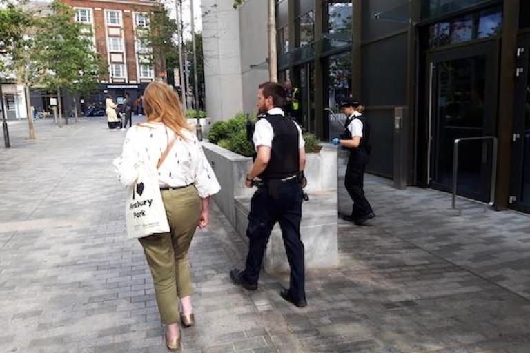 A woman and a police officer walking next to each other