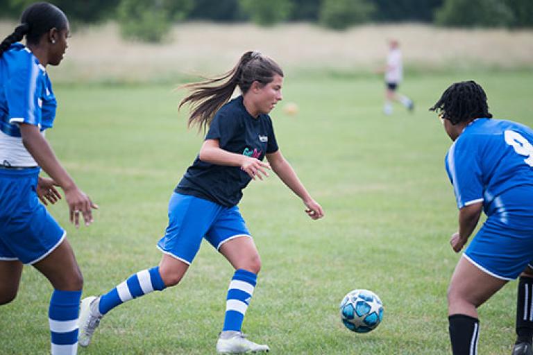 Women playing football.