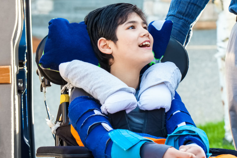 young person in a wheelchair smiling