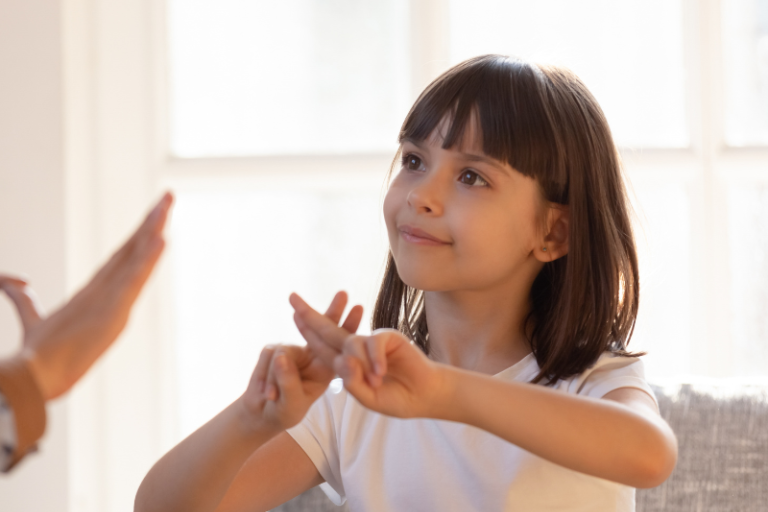 young person doing British Sign Language