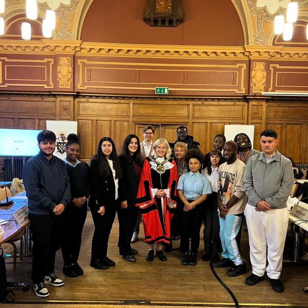 young people standing with the mayor of Haringey and leader of the council