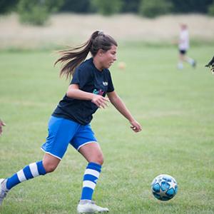 Women playing football.