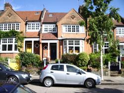 photo of the house with the Walter J MacQueen-Pope plaque